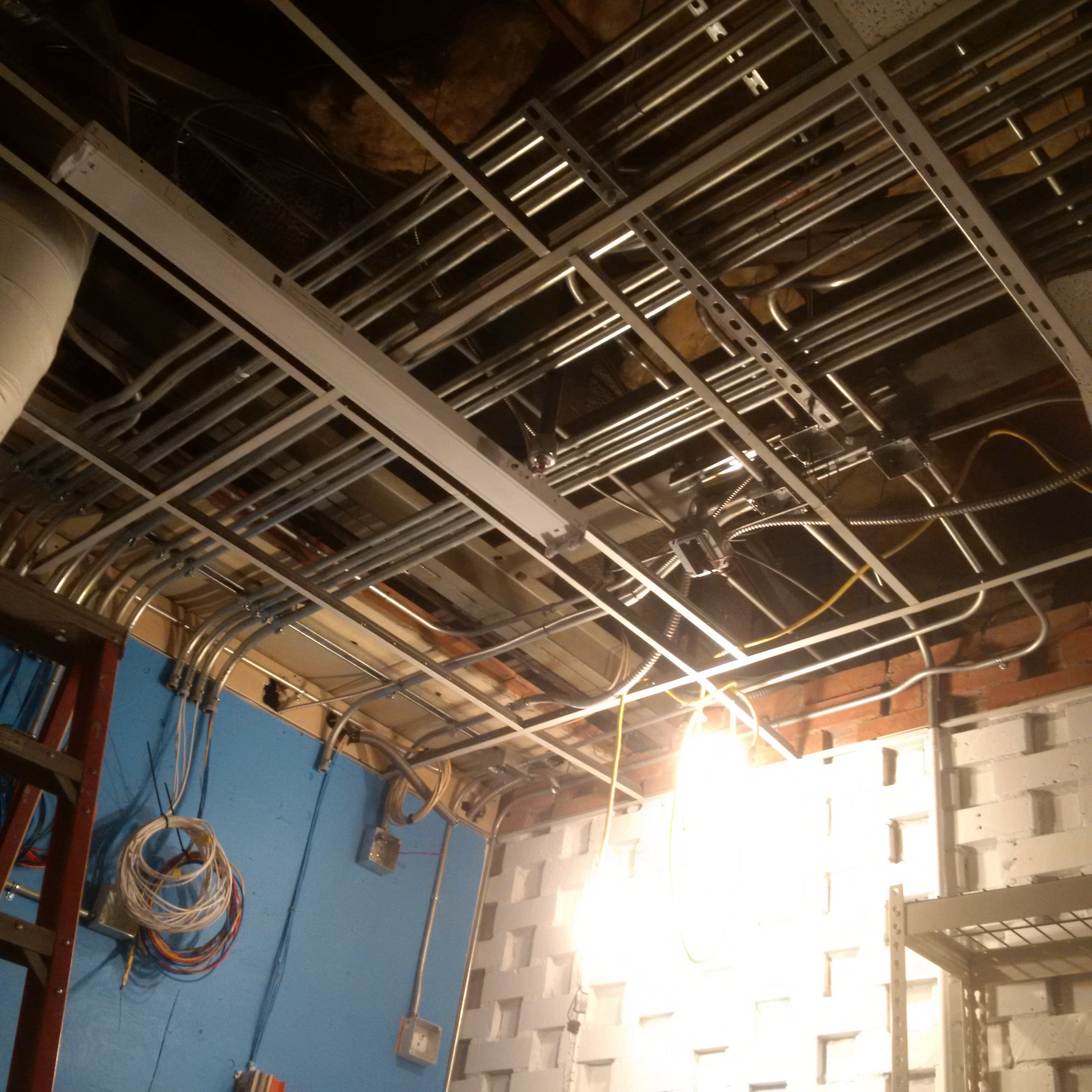 Ceiling grid electrical conduit installation
